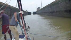taking in bow lines as doors open into Pacific ocean